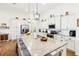 Modern kitchen with white cabinets, granite countertops, and stainless steel appliances at 2937 Bella Flore Ter, New Smyrna Beach, FL 32168