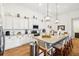 Modern kitchen with white cabinets, granite island and stainless steel appliances at 2937 Bella Flore Ter, New Smyrna Beach, FL 32168