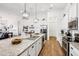 Spacious kitchen with granite countertops, stainless steel appliances, and hardwood floors at 2937 Bella Flore Ter, New Smyrna Beach, FL 32168