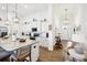 Modern kitchen with white cabinets and granite island at 2937 Bella Flore Ter, New Smyrna Beach, FL 32168