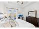 Main bedroom with backyard access and built-in dresser at 2937 Bella Flore Ter, New Smyrna Beach, FL 32168
