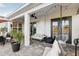 Relaxing covered patio with seating area and string lights at 2937 Bella Flore Ter, New Smyrna Beach, FL 32168