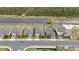 Aerial view of community with houses near a canal at 3142 Viceroy Ct, Poinciana, FL 34759