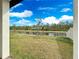 Backyard view showcasing a pond and lush green grass at 3142 Viceroy Ct, Poinciana, FL 34759