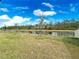 Backyard view showcasing a pond and lush green grass at 3142 Viceroy Ct, Poinciana, FL 34759