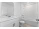 Bright bathroom featuring a white vanity and bathtub at 3142 Viceroy Ct, Poinciana, FL 34759