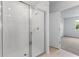 Bathroom with tiled floor and glass shower enclosure at 3142 Viceroy Ct, Poinciana, FL 34759