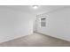 Bright bedroom with window, carpet, and door at 3142 Viceroy Ct, Poinciana, FL 34759