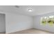 Simple bedroom with large window and light neutral tones at 3142 Viceroy Ct, Poinciana, FL 34759