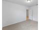 Spacious bedroom with carpeted floor and door to hallway at 3142 Viceroy Ct, Poinciana, FL 34759