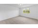 Bright bedroom with carpeted floor and large window at 3142 Viceroy Ct, Poinciana, FL 34759