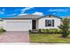 One story home with a two car garage and landscaped yard at 3142 Viceroy Ct, Poinciana, FL 34759
