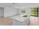 Open kitchen with a large island and access to the backyard at 3142 Viceroy Ct, Poinciana, FL 34759