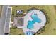 Community pool with lounge chairs and covered seating area at 3142 Viceroy Ct, Poinciana, FL 34759