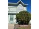 Front view of a light green two-story townhouse at 3209 Windover Ave, Kissimmee, FL 34741