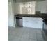 Modern kitchen with white cabinets and granite countertops at 3209 Windover Ave, Kissimmee, FL 34741