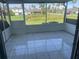 Screened-in porch with tiled floor and view of backyard at 3209 Windover Ave, Kissimmee, FL 34741