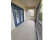 Private balcony with screened enclosure and double doors at 3341 Whitestone Cir # 205, Kissimmee, FL 34741