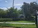 Community entrance sign for Flora Bay Condominiums at 3341 Whitestone Cir # 205, Kissimmee, FL 34741