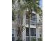 Condo building exterior showcasing balconies and landscaping at 3341 Whitestone Cir # 205, Kissimmee, FL 34741