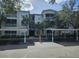 Exterior view of a condo building with parking at 3341 Whitestone Cir # 205, Kissimmee, FL 34741