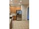 Kitchen with stainless steel appliances and wood cabinets at 3341 Whitestone Cir # 205, Kissimmee, FL 34741