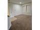 Living room with neutral carpet and tiled entryway at 3341 Whitestone Cir # 205, Kissimmee, FL 34741