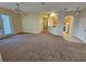 Spacious living room with carpet and kitchen views at 3341 Whitestone Cir # 205, Kissimmee, FL 34741