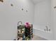 Relaxing bathroom with a soaking tub and modern fixtures, complemented by a tiled floor at 434 Panaro Ln, Haines City, FL 33844