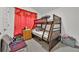 Functional bedroom featuring bunk beds, storage and neutral walls at 434 Panaro Ln, Haines City, FL 33844