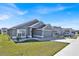 Street view of a gray single-story home with well-kept lawn and minimal landscaping at 434 Panaro Ln, Haines City, FL 33844