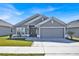 Charming single-story home with a well-manicured lawn and a two-car garage at 434 Panaro Ln, Haines City, FL 33844