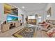 Bright living room with tile floors, comfortable couches, and stylish decor at 434 Panaro Ln, Haines City, FL 33844