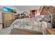 Elegant primary bedroom featuring a decorative headboard, decorative bedding and neutral walls at 434 Panaro Ln, Haines City, FL 33844