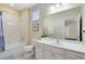 Clean bathroom with a bathtub, single vanity, and updated finishes at 4439 Shiva Loop, Kissimmee, FL 34746