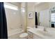 Clean bathroom with a bathtub, shower, sink, and toilet at 4439 Shiva Loop, Kissimmee, FL 34746