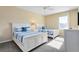 Spacious bedroom with two twin beds, ample lighting, and neutral decor at 4439 Shiva Loop, Kissimmee, FL 34746