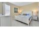 Main bedroom with king-size bed and white dresser at 4439 Shiva Loop, Kissimmee, FL 34746