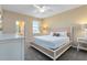 Bright bedroom featuring a comfortable queen-size bed at 4439 Shiva Loop, Kissimmee, FL 34746