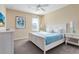 Bright bedroom featuring a king-size bed and stylish furnishings at 4439 Shiva Loop, Kissimmee, FL 34746