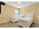 Charming bedroom with twin beds, neutral walls, and natural light at 4439 Shiva Loop, Kissimmee, FL 34746