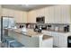 Bright kitchen with granite countertops and stainless steel appliances at 4439 Shiva Loop, Kissimmee, FL 34746