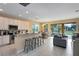 Open kitchen with island, stainless steel appliances, and breakfast bar at 4439 Shiva Loop, Kissimmee, FL 34746