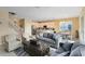 Spacious living room with comfortable seating and views to the kitchen and dining area at 4439 Shiva Loop, Kissimmee, FL 34746