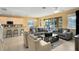 Open living and kitchen area with ample natural light and comfortable seating at 4439 Shiva Loop, Kissimmee, FL 34746