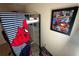 A bedroom with a Spiderman theme, featuring a metal bunk bed and a framed poster at 446 Citrus Isle Loop, Davenport, FL 33837