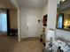 Welcoming foyer with tiled floor, decorative mirror and console table adding style to the entrance at 446 Citrus Isle Loop, Davenport, FL 33837