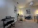 A bright and spacious office space featuring multiple desks, carpet flooring, and tasteful wall decor at 446 Citrus Isle Loop, Davenport, FL 33837