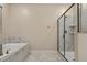 Bathroom with soaking tub and walk-in shower at 4575 Narrative Ln, Kissimmee, FL 34746