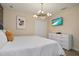 King-size bed, modern decor, and large TV in this elegant bedroom at 4575 Narrative Ln, Kissimmee, FL 34746
